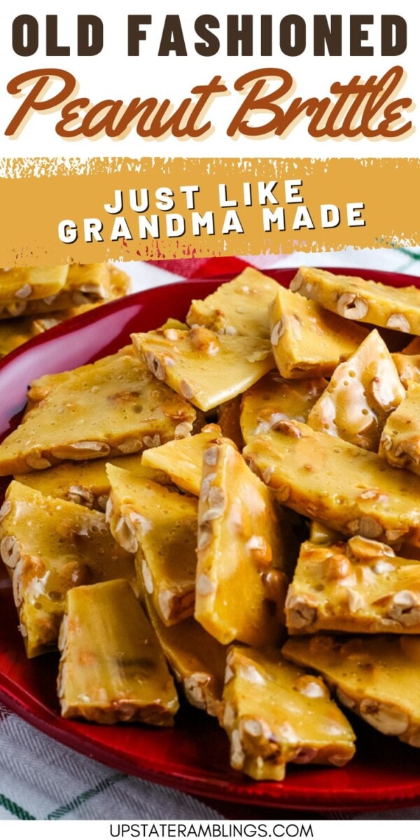 A red plate filled with pieces of peanut brittle. Text above reads "Old Fashioned Peanut Brittle Just Like Grandma Made.